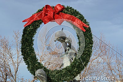 Christmas wreath on Dolphin statue Editorial Stock Photo