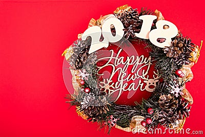 Christmas Wreath, Holiday Composition on a Red Background. Top View. Stock Photo