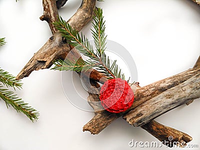 Christmas wreath closeup. Tree and fir branches. Red flower. White background. Minimalistic design Stock Photo