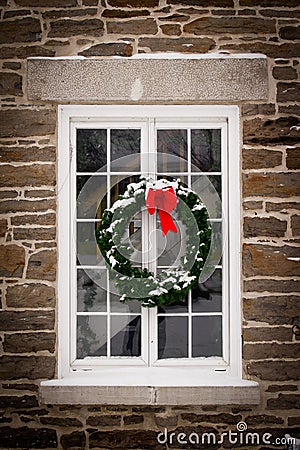 Christmas Wreath on Old Window Pane Stock Photo