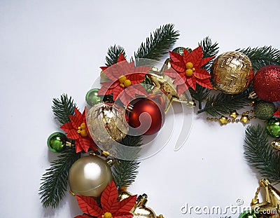 Christmas wreath on white background, banner with fir branches and balls. View from above. Colors are gold, red, green and white. Stock Photo