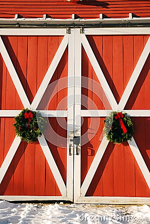 Christmas wreathes on a barn door Stock Photo