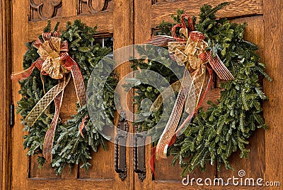 Christmas wreaths on wooden doors Stock Photo