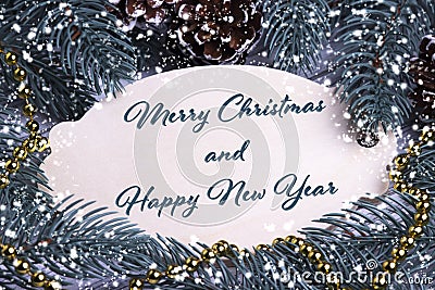 Christmas Xmas New Year Holiday greeting card wooden tablet text Merry Chrismas and Happy New Year fir branches cones gold Stock Photo