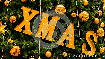 Christmas xmas sign on christmas tree Stock Photo
