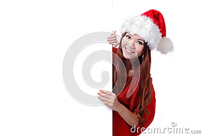 Christmas young girl showing blank billboard Stock Photo