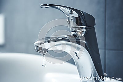 Chrome faucet washbasin. Water tap. Stock Photo