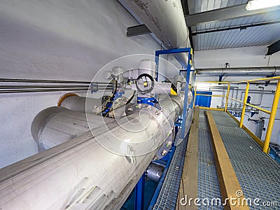 Chrome metal high pressure pipeline with servo drive valves Stock Photo