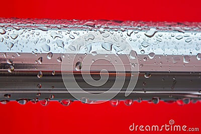 Chrome pipe covered with raindrops Stock Photo