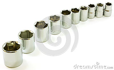 Chrome ratchet sockets in a curve, on white Stock Photo