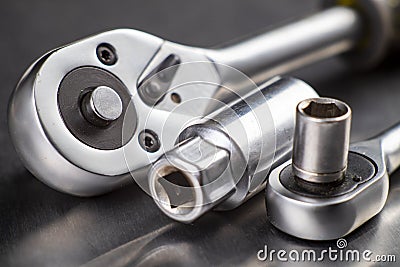 Chrome ratchet wrenches on the workbench. Tools used for mechanical repairs Stock Photo