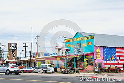 Chrysler Police Car in front of Historic Seligman Sundries Cafe. Editorial Stock Photo