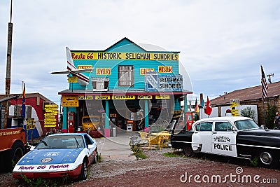 Chrysler Police Car in front of Historic Seligman Sundries Cafe. Editorial Stock Photo