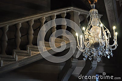 Chrystal chandelier in baroque staircase Stock Photo
