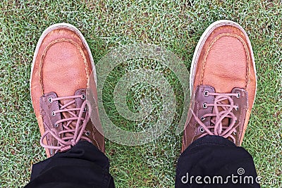 Chukka boots view from above feet on grass Stock Photo