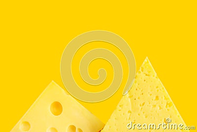 Chunk and wedge of Alpine creamy Tilsit Maasdam cheese on yellow background. Local delicacy produce healthy versatile diet Stock Photo