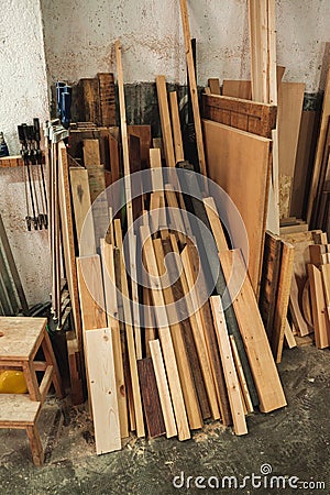 Chunks and pieces of wood leaning against the wall Stock Photo