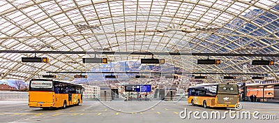 Post Buses at the bus station in the city of Chur in Switzerland Editorial Stock Photo