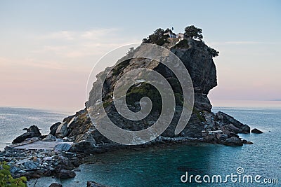 The church of Agios Ioannis Kastri on a rock at sunset, famous from Mamma Mia movie scenes, Skopelos Island Stock Photo