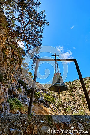 Church bell of lost Orthodox church of St John the Hermit in hills, Akrotiri, Crete, Greece. Upshot at daytime in spring Stock Photo