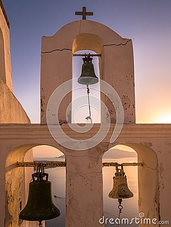 Church Bell Tower at Sunset in Santorini, Greece Stock Photo