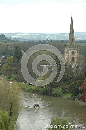 Church and boat in river at stratford upon avon, england, united kingdom Stock Photo