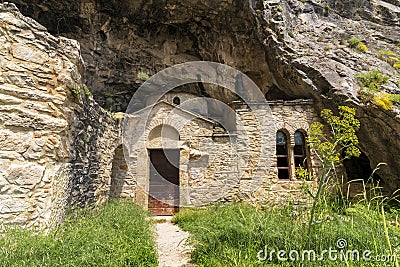 Church of the Byzantine age built directly into the front of the daveli cave, hidden in Panteli Mountain near Athens city, Greece Stock Photo