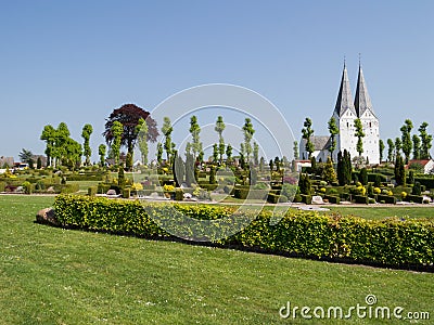 Church and Cemetery in a Small Countryside Town in Denmark Stock Photo