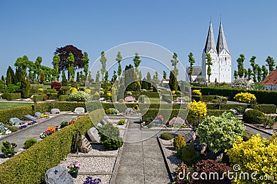 Church and Cemetery in a Small Countryside Town in Denmark Stock Photo