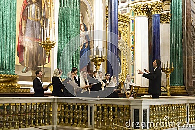 Church choir with conductor singing during the church service Editorial Stock Photo