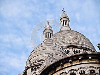 Church domes with intricate detail under blue sky with light clouds Stock Photo