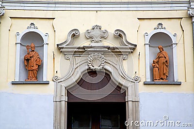 church door in italy lombardy shield statue Stock Photo