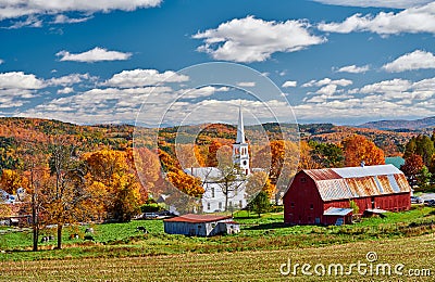 Church and farm with red barn at autumn Stock Photo