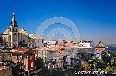 Church and hillside homes in a suburb of Valparaiso Stock Photo