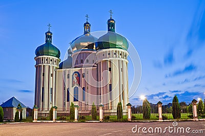 Church in the light of evening lanterns. Holy Protection Church in the city Dubno, Ukraine Stock Photo