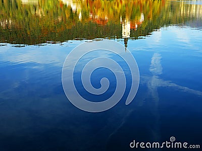 The Church of Mary the Queen mirrored in the water of Lake Bled in autumn. Stock Photo