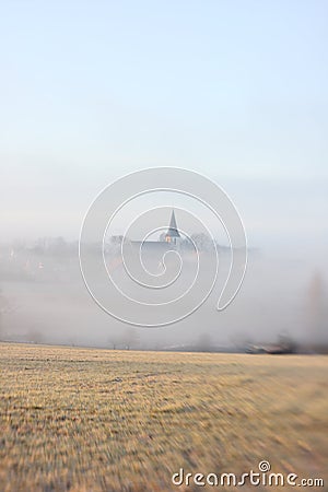 Church in the mist Stock Photo