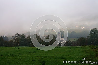 Church in mist near Bajina Basta, Serbia Stock Photo