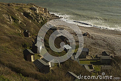 Church Ope Cove, looking down on beach huts and bay Stock Photo