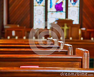 Church Pews with Stained Glass Stock Photo