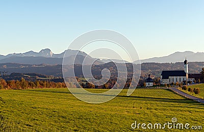 Church of pilgrimage Wilparting with Bavarian Alps in the background Stock Photo