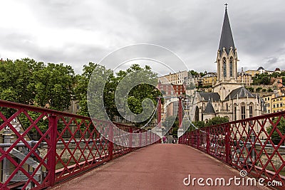 Church of Saint Georges and footbridge, Lyon, France. Panoramic view of Saint Georges church and pedestrian footbridge across Saon Editorial Stock Photo