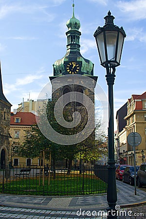 Church saint Peter in Prague, bell tower with clock Stock Photo