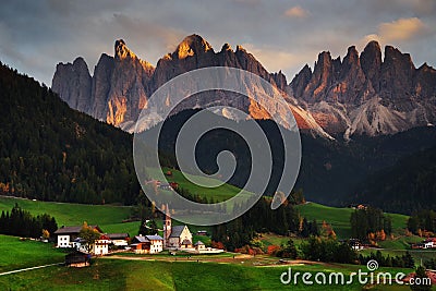 The church Santa Maddalena with the impressive Odle Mountains Group in the background, at sunset. Stock Photo