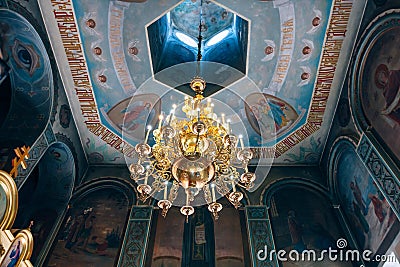 Church of St. Nicholas, large gold or bronze chandelier in the temple or cathedral Editorial Stock Photo