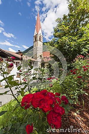 Church of St Pankraz behind roses Stock Photo