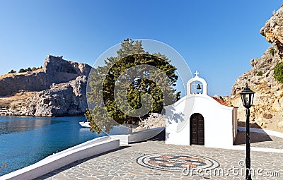Church of St. Paul and the ancient Acropolis of old Lindos at Greek Rhodes Stock Photo
