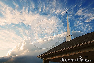 Church Steeple against a cloudy sky Stock Photo