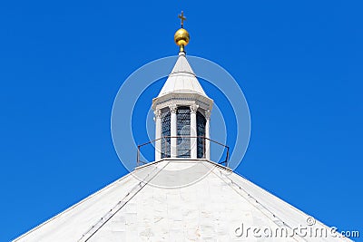 Church tower with a golden cross Stock Photo