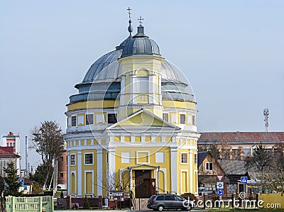 The church is a two-tier stone-rotunda temple with a hemispherical dome on a step drum, as well as an octal bell tower with a Stock Photo